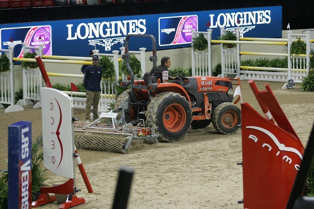 A tractor pulling a Platz Max arena drag at the world cup