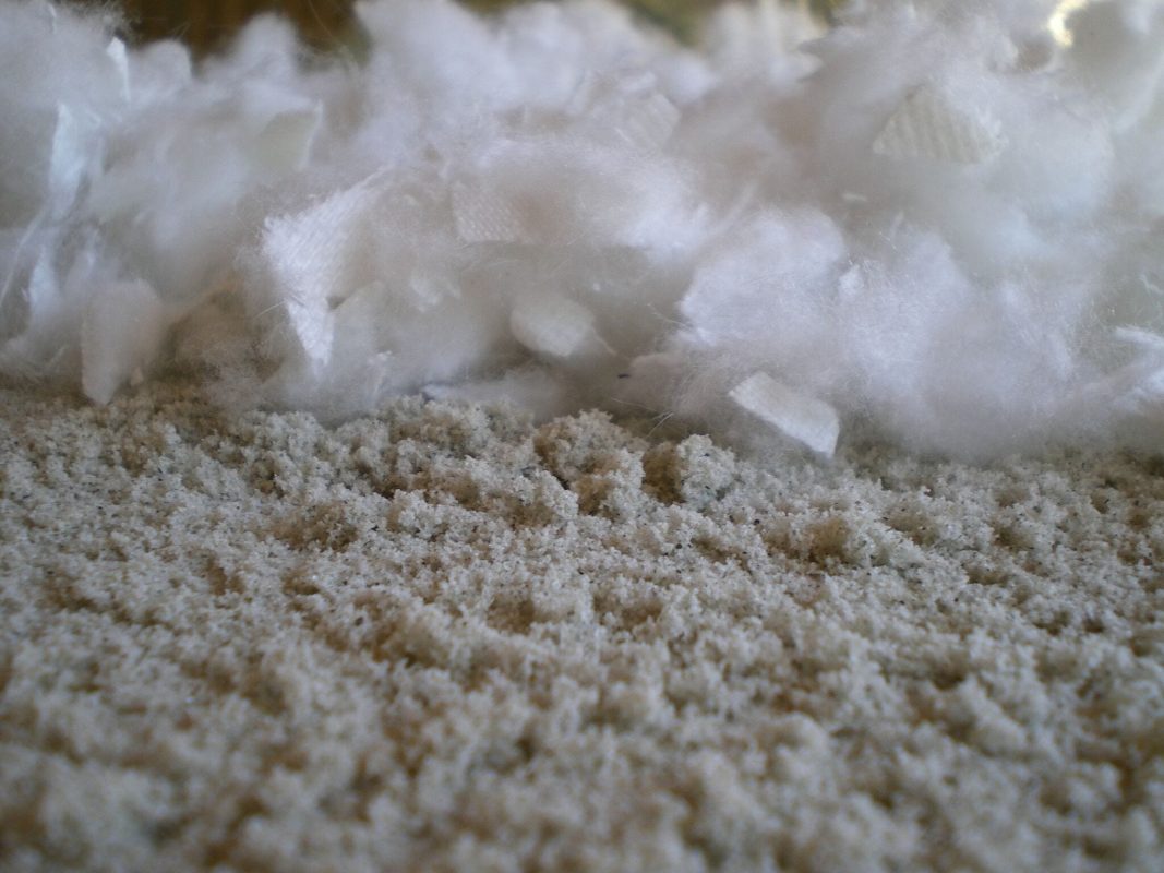 A closeup of FSGeoTEX fibers next to sand