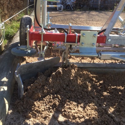 An arena drag track cleaner in action.