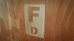 Dressage letters F and D on a kickwall