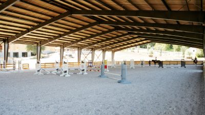 A covered jumping arena completed with fsgeotex sand additives