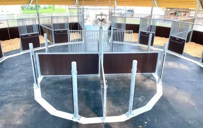 Tack stalls at the center of a round barn, with stalls on the outer perimeter