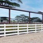 An outdoor horse arena is lined with Diamond Arena Mirrors