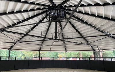 The roof of a fully covered horse walker, looking up from the inside