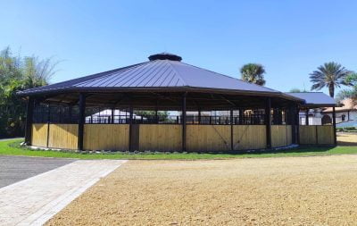 A fully covered, round horse exerciser from the outside