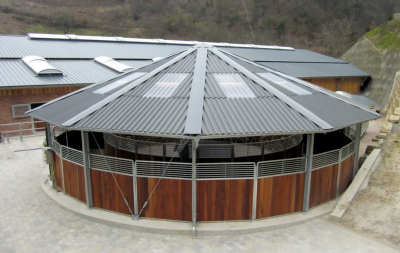 A fully covered, round horse walker