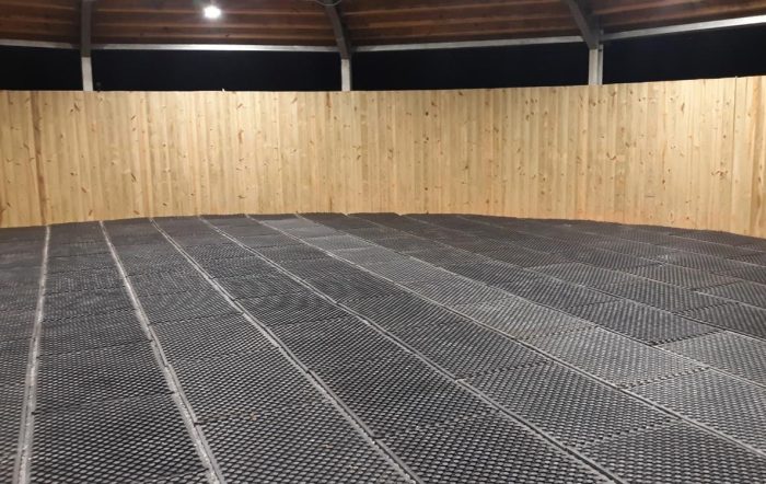 A round pen with arena mats installed