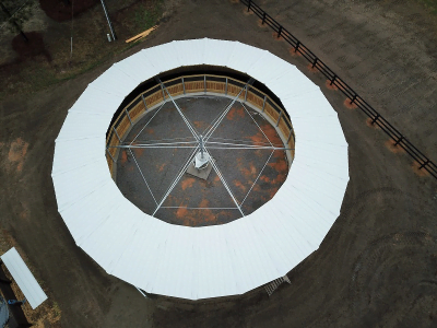 A birds-eye-view of a round horse walker with uncovered center