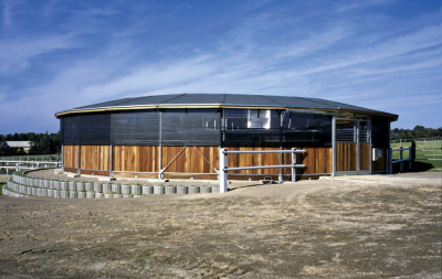 A round horse walker with shades, taken from the outside