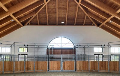 A custom oval horse walker, taken from the inside of a covered building