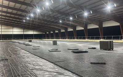The largest arena under construction: water lines down with HIT Draingrids in the process of being laid over them.
