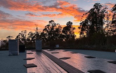 The sun sets over the outdoor arena in Half Moon Bay during construction.