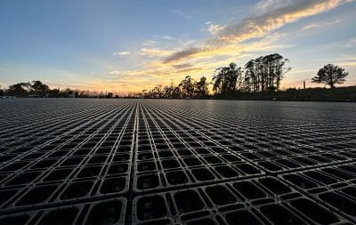 The sunset is the backdrop of HIT DrainGrids, which have been laid in the new outdoor arena in Half Moon Bay.