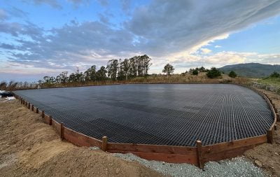 A wide angle shot of the outdoor arena at Half Moon Bay under construction, with HIT DrainGrids installed.