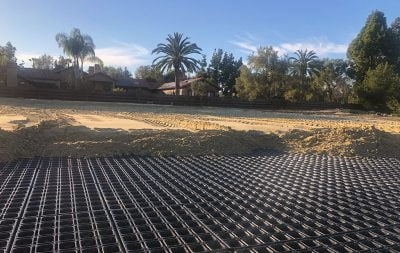 The arena base at the Rancho Santa Fe partially covered in sand.