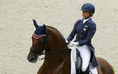 Anna Buffini riding her dressage horse.