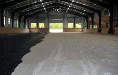 Sand being laid at the indoor arena in Langley, BC.
