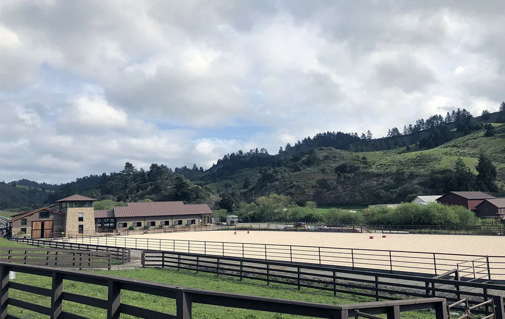 A riding arena at the base of a lovely hill in Pomponio Ranch.